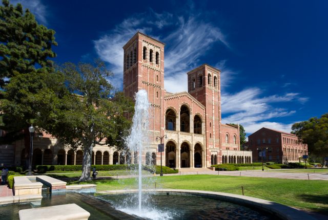 A photo of Royce Hall against wispy clouds and a striking blue sky