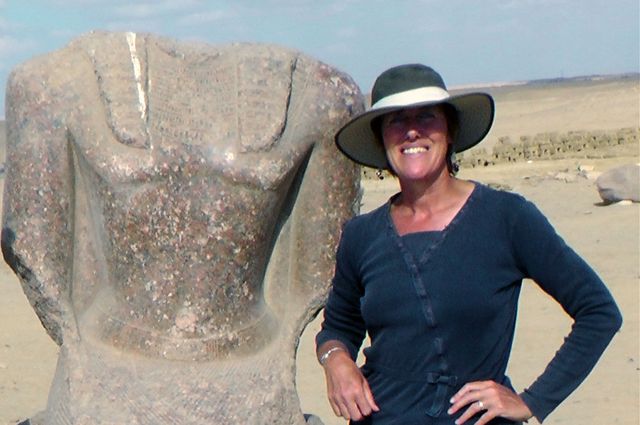Willeke Wendrich poses with a stone figure