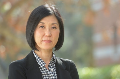 portrait of Miwon Kwon against an outdoor background