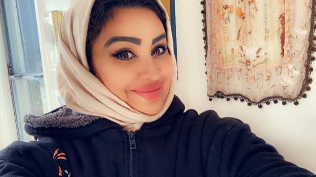 Abeer Ali Abdullah Al-Abbas smiles at the camera in a selfie