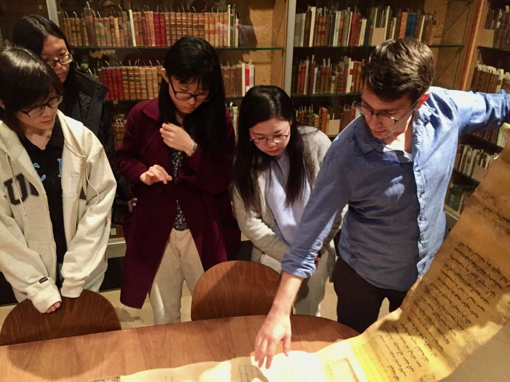 Devin Fitzgerald works with students in UCLA Library's Special Collections
