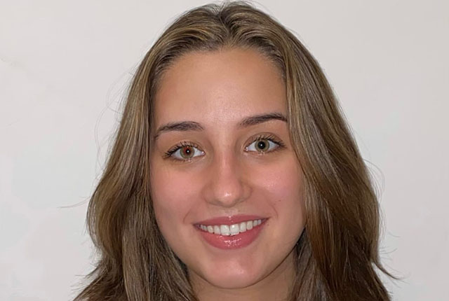 Headshot of Laura Czerniecki smiling at the camera