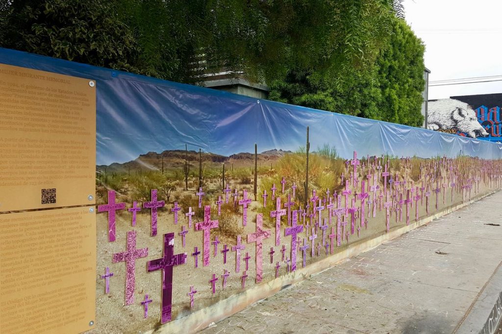 Mural covered in pink and purple crosses in the desert