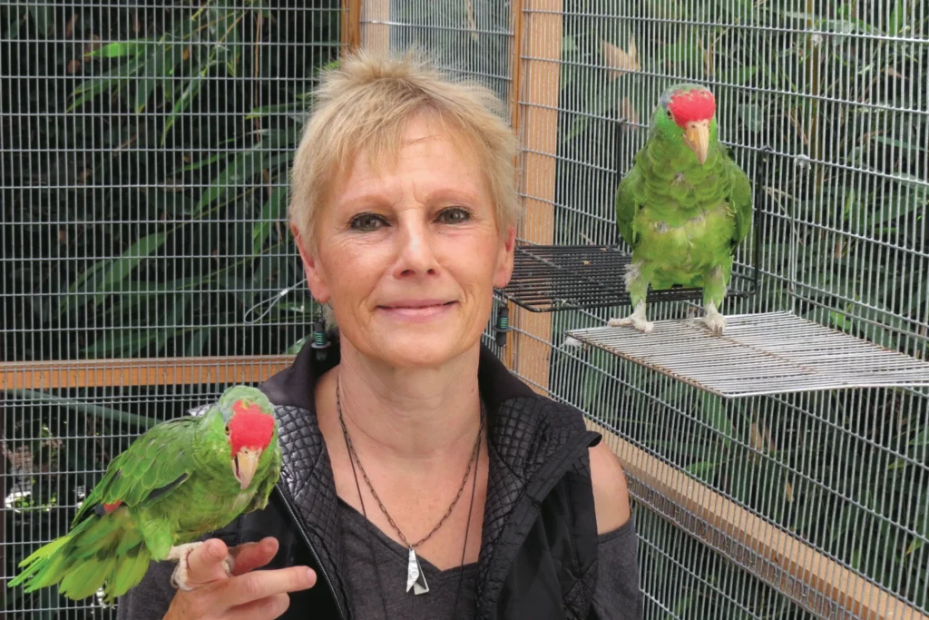 Ursula Heise holding a bird on her hand