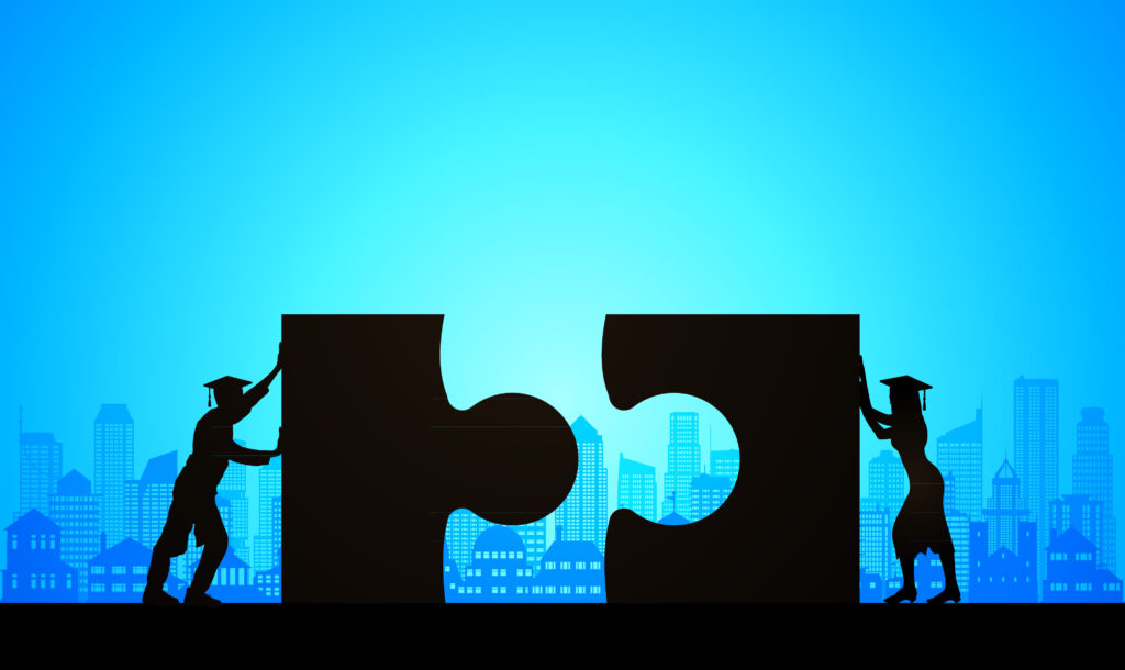 Illustration of two silhouetted figures pushing puzzle pieces together with city buildings in the background